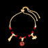 This Red and Black Evil Eye bracelet, adorned with 14k gold-filled Figa hand and Elephant lucky charms, features a striking combination of red and black beads. It is elegantly finished with an adjustable sliding clasp and two delicate gold dangling strands for a perfect fit.